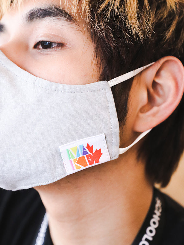 Close-up of grey face mask on model
