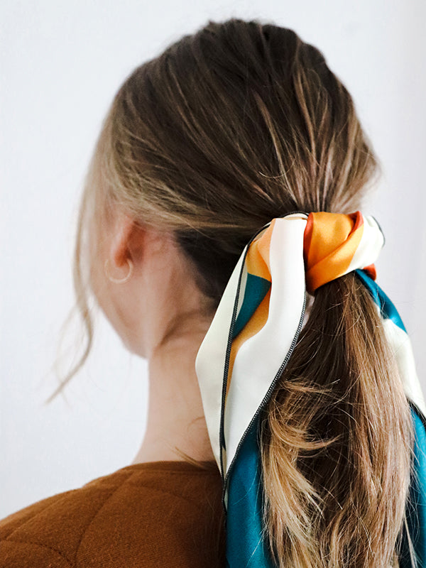 person wearing silk bandana