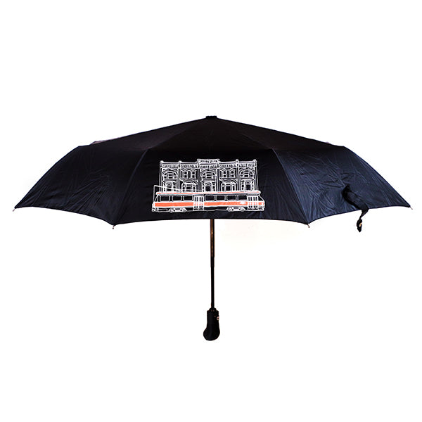 black umbrella with toronto street car illustration in white and red