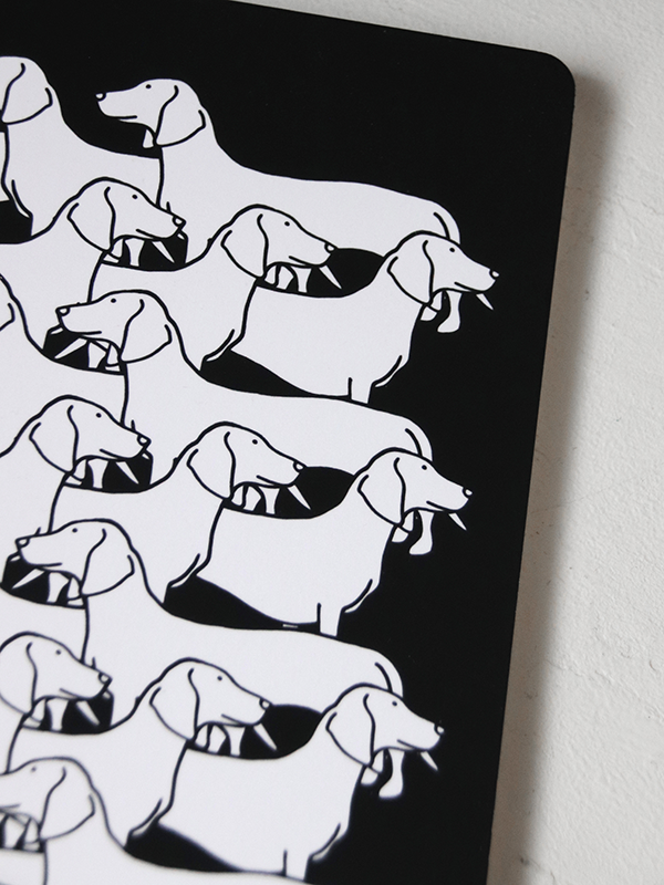 close up of white dog illustration pattern on black notebook