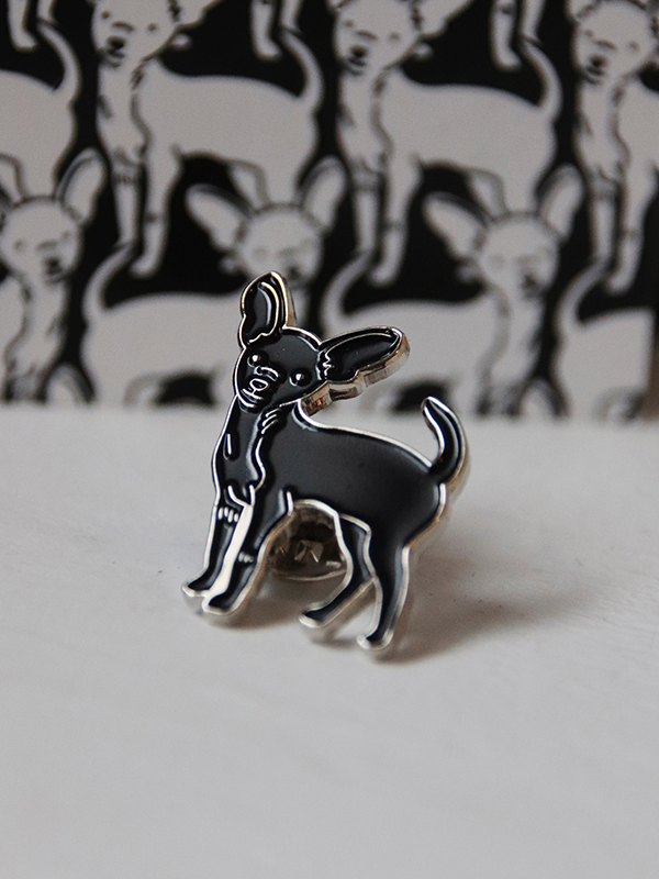 close up of black chihuahua enamel pin