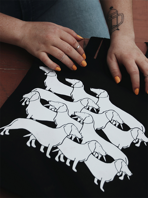 black tote bag with girls hand