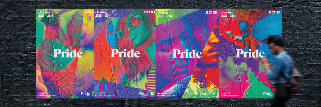Person walking by Pride Toronto 2018 posters