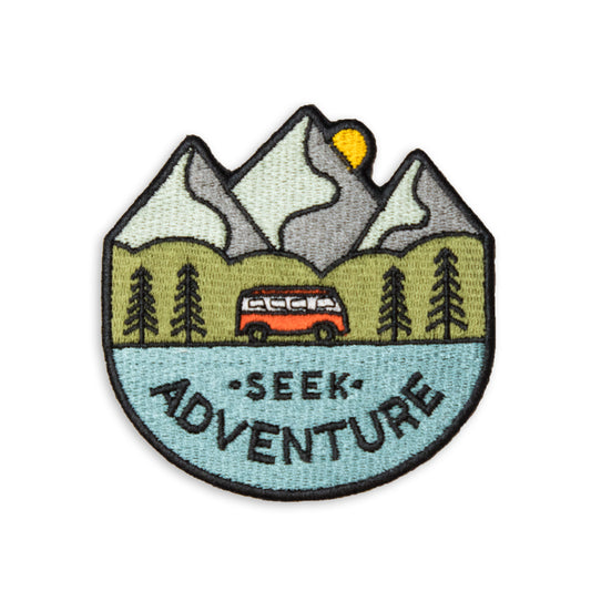 3" x 3" embroidered patch showcasing a van driving, mountains in the back ground and seek adventure text