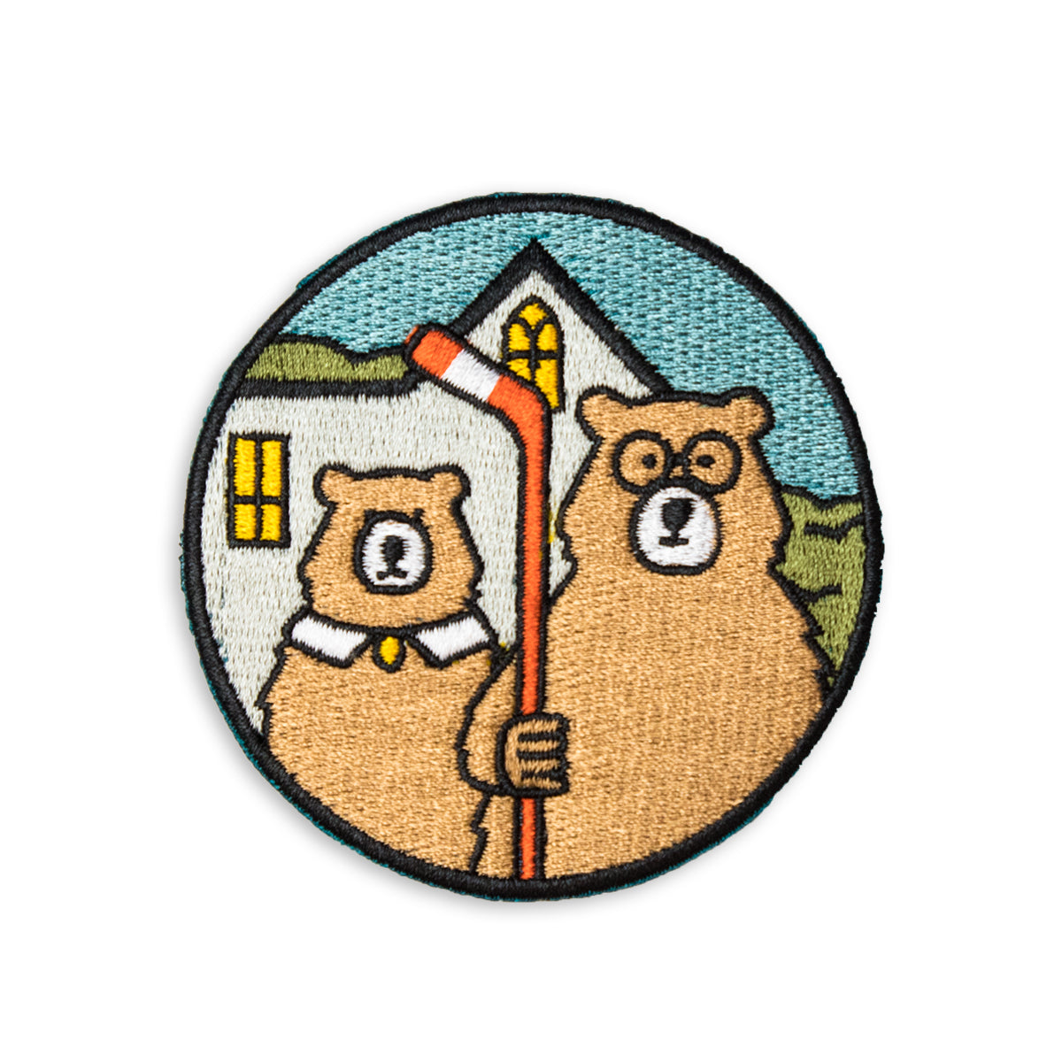 3" x 3" embroidered circle patch with two bear illustrations, one holding a hockey stick, in front of a house inspired by american gothic painting