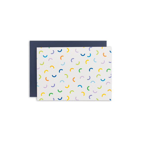 4 1/2" x 6 1/4"  white greeting card with semi circle macaroni pattern in shades of orange, yellow, green, purple and blue