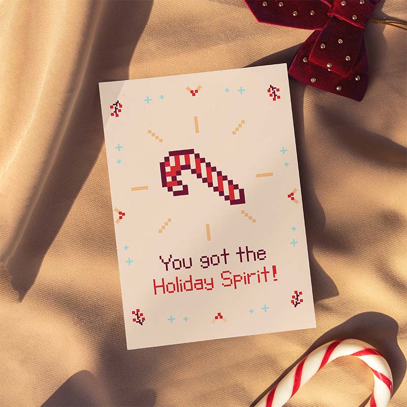 pixel illustration of candy cane (red and white) on beige card. text reading "you've got the holiday spirit!"