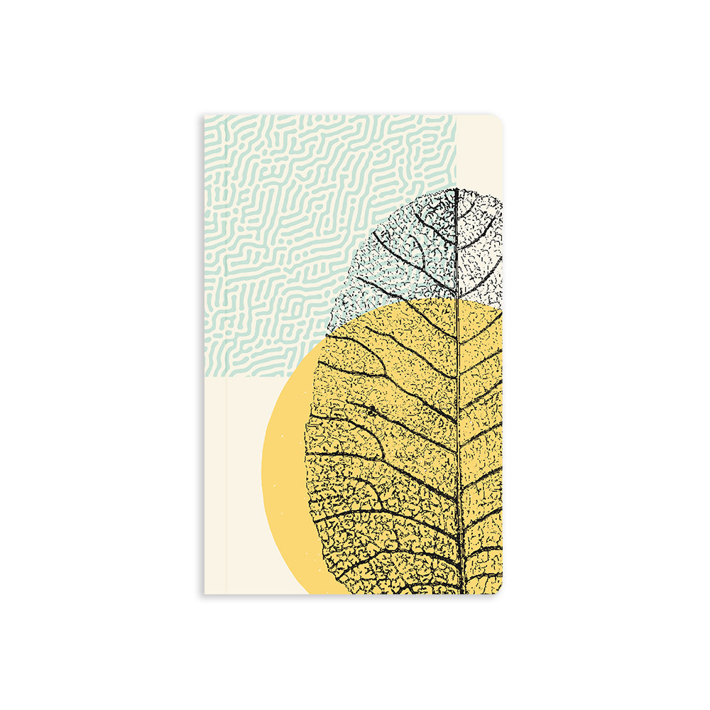 5" x 8.25" soft cover beige notebook with black flat lay leaf in stamped texture, yellow circle and blue pattern in the background