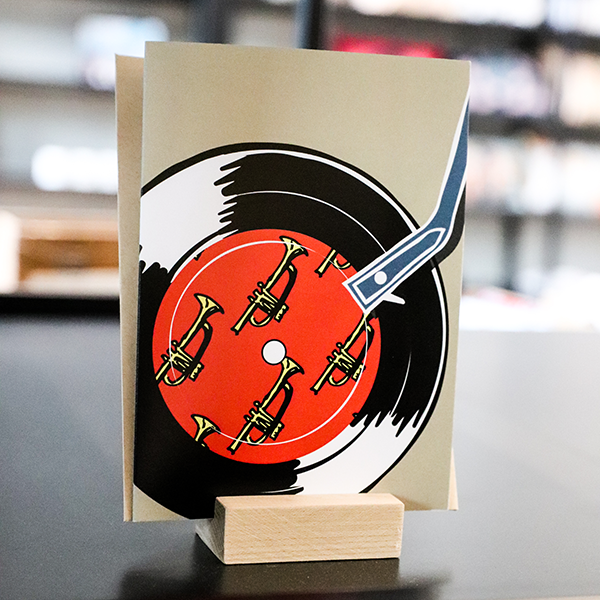 4 1/2" x 6 1/4" beige greeting card with record player illustration, featuring a vinyl with little yellow trumpets in the middle
